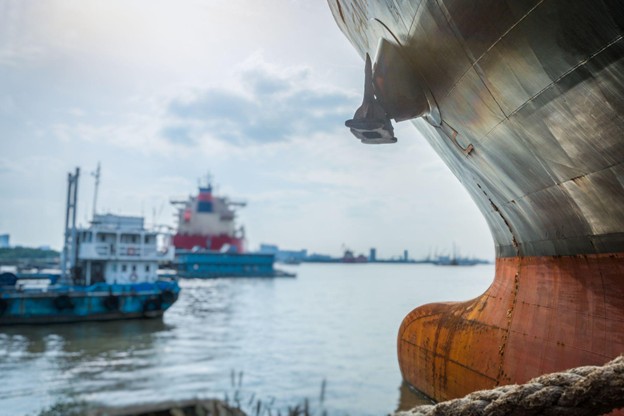 A cargo ship docked at the port, signifying the need for Marine–Cargo insurance in Gujarat
